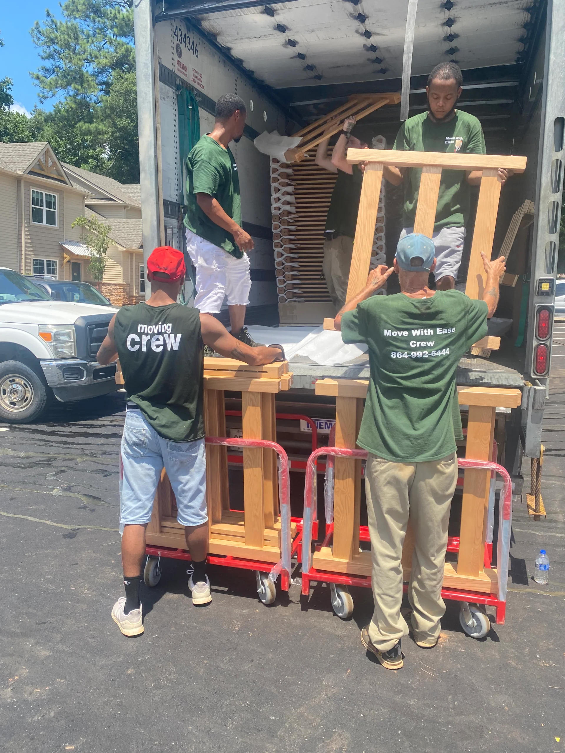 guys unloading a business from a moving truck